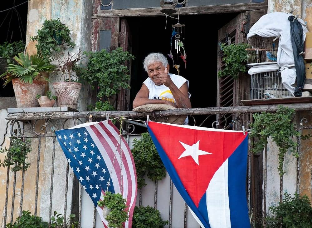 Support for the Cuban People - Cuban giving thumbs up from balcony (1)