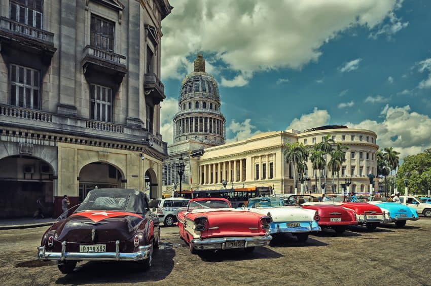 Line of classic cars parked in Havana